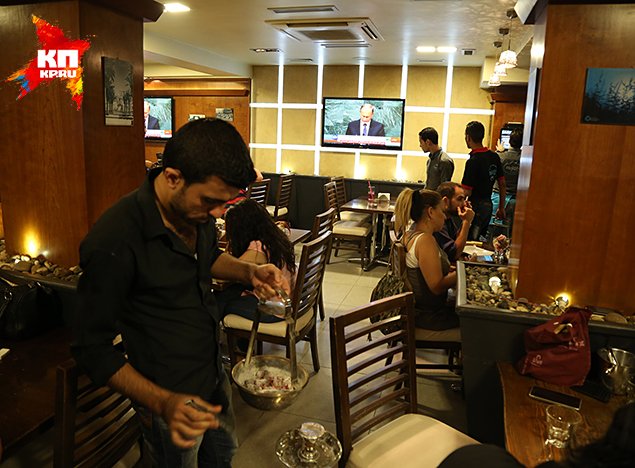 In the Mazza region, in one of the cafes, in front of big screens, full of people. Photo: Alexander of KOTS, Dmitry STESHIN
