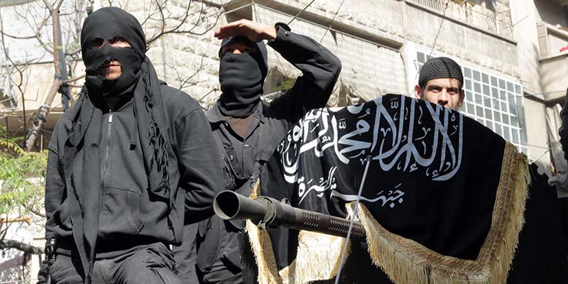 Members of jihadist group Al-Nusra Front take part in a parade calling for the establishment of an Islamic state in Syria, at the Bustan al-Qasr neighbourhood of Aleppo, on October 25, 2013. The conflict in Syria, which erupted after President Bashar al-Assad launched a bloody crackdown on Arab Spring-inspired democracy protests, is believed to have killed more than 115,000 people. AFP PHOTO / KARAM AL-MASRI (Photo credit should read KARAM AL-MASRI/AFP/Getty Images)