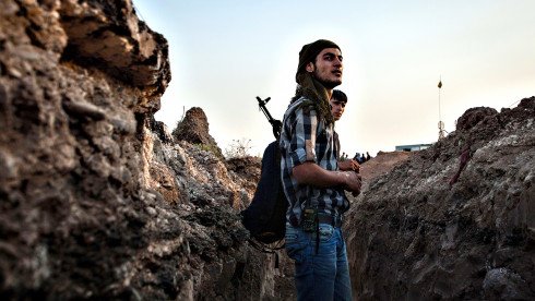 Fighters of the Kurdish of the Committee...Fighters of the Kurdish of the Committees for the Protection of the Kurdish People (YPG) stand in a trench holding a position on August 28, 2013 about 30 kms south of the Kurdish town of Derik (aka al-Malikiyah in Arabic), in northeastern Hasakeh governorate, on the border with Turkey and Iraq. In recent weeks dozens of militants were killed as Kurdish and Arab rebels clashed in Syria's northeastern Hasaka province. AFP PHOTO ALICE MARTINSALICE Martins/AFP/Getty Images