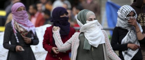A group of Palestinian women fighting Israeli forces in Hebron, the West Bank