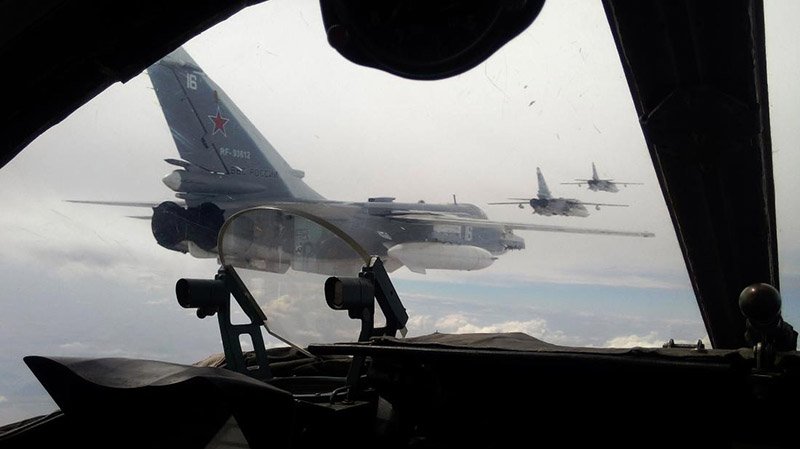 Russian Air Force Su-24 bombers fly during a military exercise in southern Russia on February 11, 2015. Marathon talks in Belarus ended on February 12 with a ceasefire announcement in the war between Ukraine and pro-Moscow rebels, but Germany's Chancellor Angela Merkel warned that "big hurdles" remained. AFP PHOTO / SERGEY VENYAVSKY (Photo credit should read SERGEY VENYAVSKY/AFP/Getty Images)