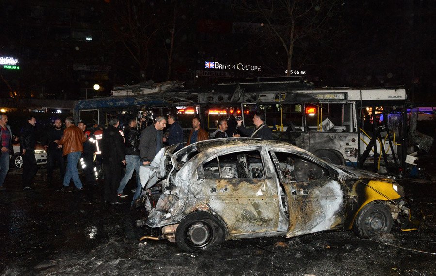 ANKARA, TURKEY - MARCH 13: The wreckage of a car and a bus is seen after an explosion in Ankara's central Kizilay district on March 13, 2016 in Ankara, Turkey. The Ankara governor's office has reported that at least 27 people have been killed and 75 wounded in an explosion in the Turkish capital Ankara. The explosion is believed to have been a car bomb attack according to Ankara governor Mehmet Kiliclar. (Photo by Defne Karadeniz/Getty Images)