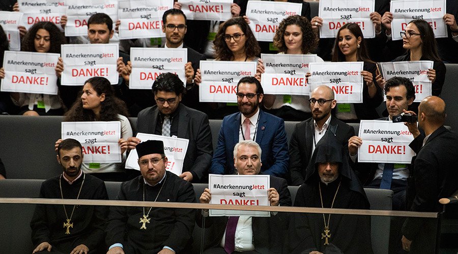 Armenian clergy men and activists react after law makers voted to recognise the Armenian genocide after a debate during the 173rd sitting of the Bundestag, the German lower house of parliament, in Berlin on June 2, 2016 © Odd Andersen / AFP