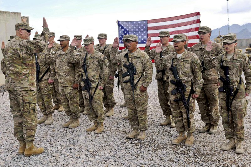 Army Chief of Staff Gen. Raymond T. Odierno reenlists soldiers from Forward Operating Base Frontenac, Feb. 22, 2013. Odierno had a small group discussion and lunch with the soldiers following the ceremony. (U.S. Army photo by Sgt. Ashley Bell)