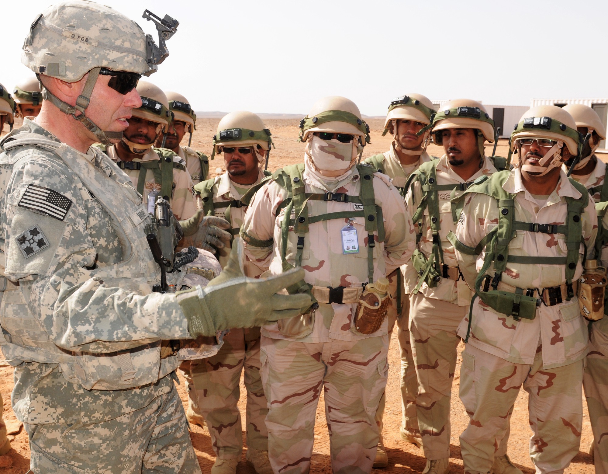 An American soldier talks with Saudi troops. Army photo