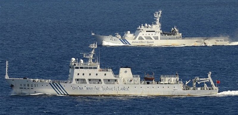 A Japan Coast Guard Cutter confronting a China Marine Surveillance vessel within the territorial waters of the Senkaku Islands. Such incidents have increased in recent weeks.