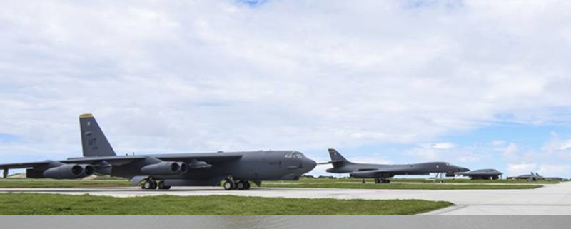 B-52, B-1 and B-2 bombers all parked on the tarmac at Andersen Air Force Base on the island of Guam.