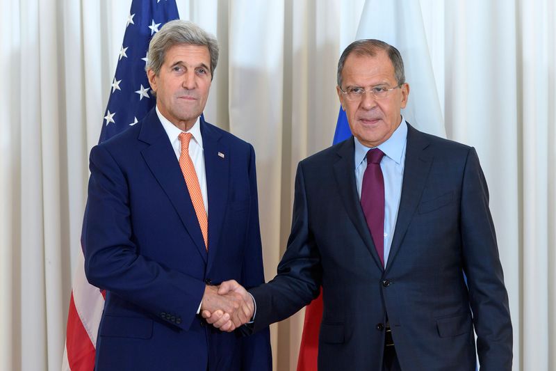 US Secretary of State John Kerry, left, shakes hands with Russian Foreign Minister Sergei Lavrov, on Aug. 26, 2016, as they met in Geneva for an expected push towards resuming peace talks for war-ravaged Syria. Photographer: Martial Trezzini/AFP via Getty Images