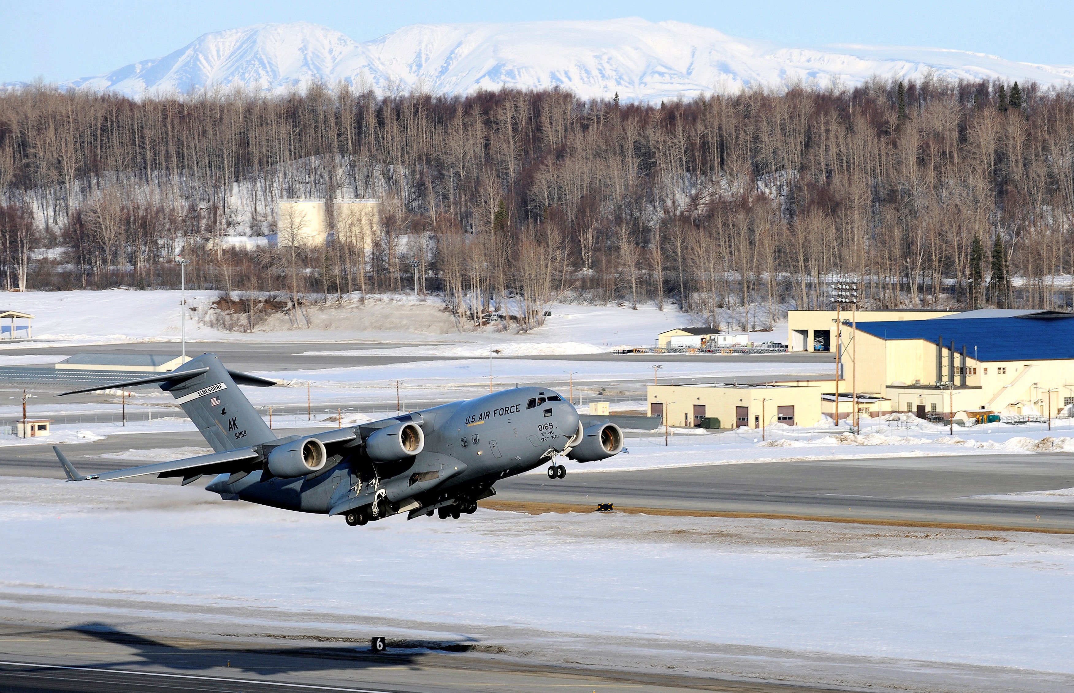 A C-17 Globemaster III takes off from Elmendorf Air Force Base March 26. Col. Thomas Bergeson, 3rd Wing commander and F-22 Raptor pilot, was behind the controls of the aircraft for the first time. The flight included a KC-135 Stratotanker refuel, tactical arrivals and departures at Allen Army Air Field and low-level flying. (U.S. Air Force photo/Staff. Sgt. Brian Ferguson)