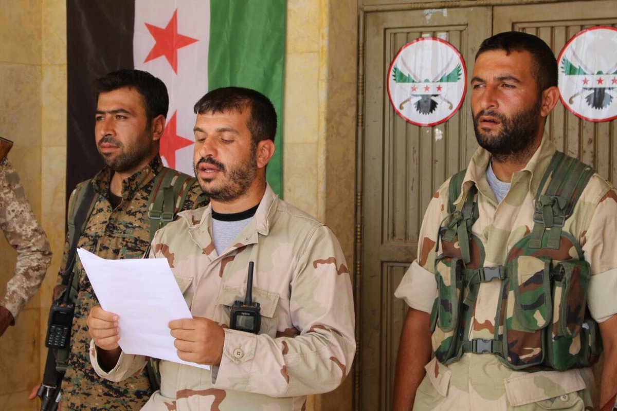 Abdulsetar Cadir is in the center