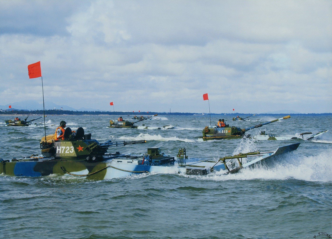 PLA Marines practicing amphibious landings with ZBD05 IFVs and ZBT05 light tanks. These amphibious armored vehicles provide a balance of speed, flexibility and firepower.