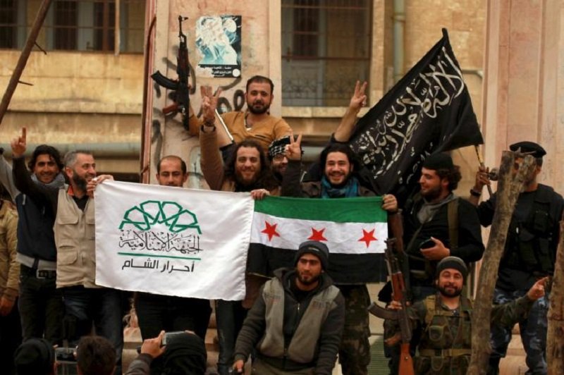 Western-backed 'freedom fighters' wave flags of Ahrar al-Sham and the Free Syrian Army alongside with the flag of Jabhat al-Nusra (the Syrian branch of al-Qaeda)