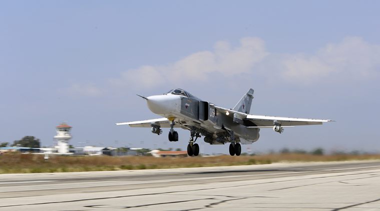 Russian SU-24M jet fighter armed with laser guided bombs takes off from a runaway at Hmeimim airbase in Syria. (Source: AP)