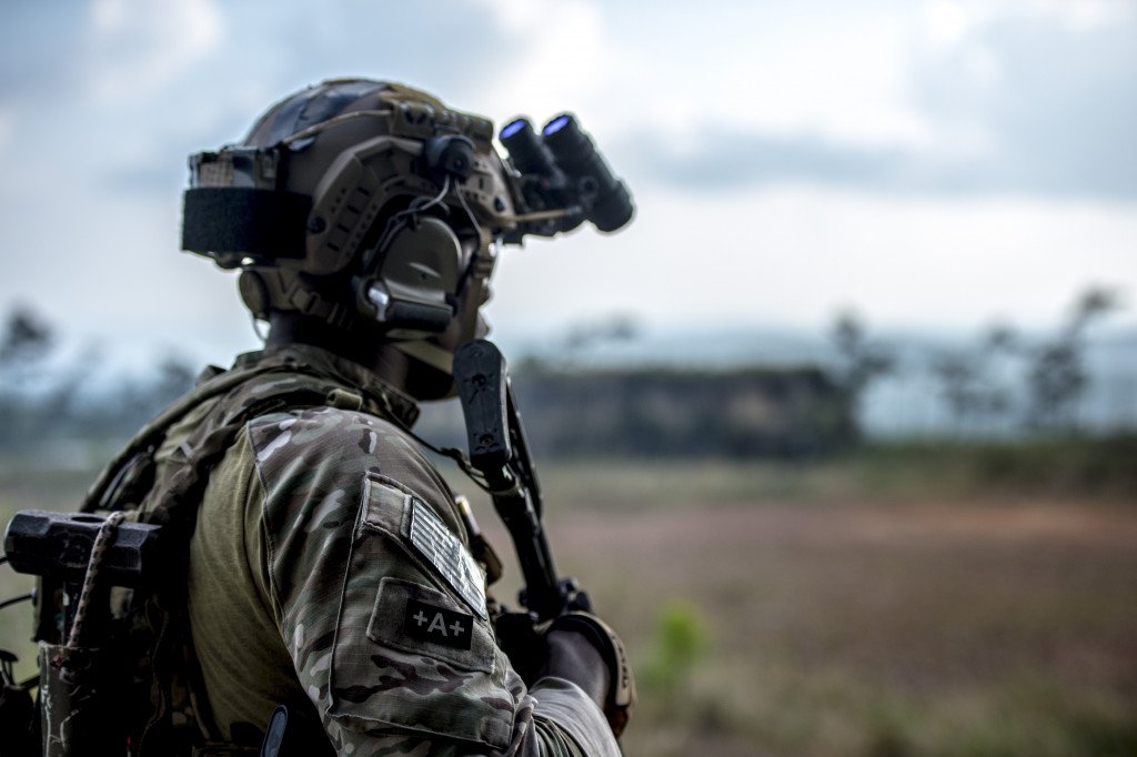 A U.S. Special Forces soldier observes a location of interest while on a mission during Fused Response 2014. The exercise, sponsored by U.S. Southern Command and executed by Special Operations Command South, aims to improve interoperability, tactics, and training techniques between U.S. SOF and Belize Defence Forces. (U.S. Navy photo by Mass Communication Specialist First Class Elisandro T. Diaz/Released)