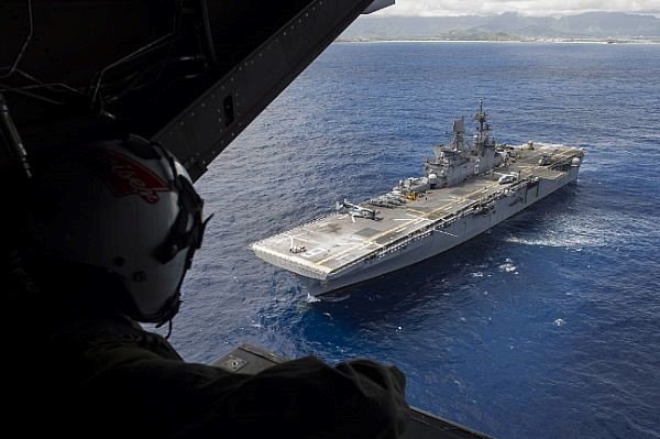 USS America LHA-6 as seen from the rear ramp of a V-22 Osprey.