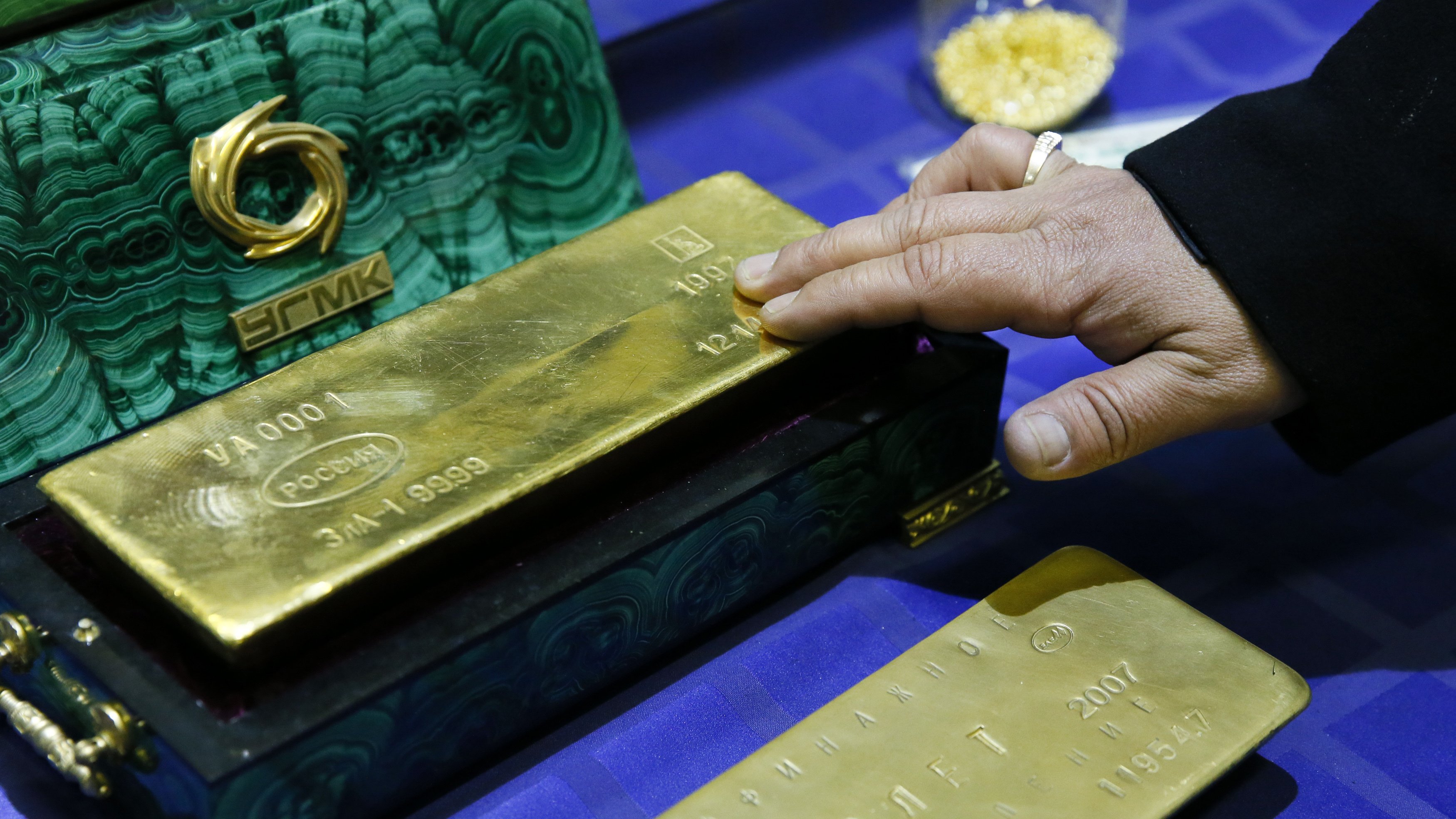 An employee displays a gold bar at a gold refining workshop of the plant of Uralelektromed Joint Stock Company (JSC), the enterprise of Ural Mining and Metallurgical company (UMMC) in the town of Verkhnyaya Pyshma, outside Yekaterinburg, Oct. 17.