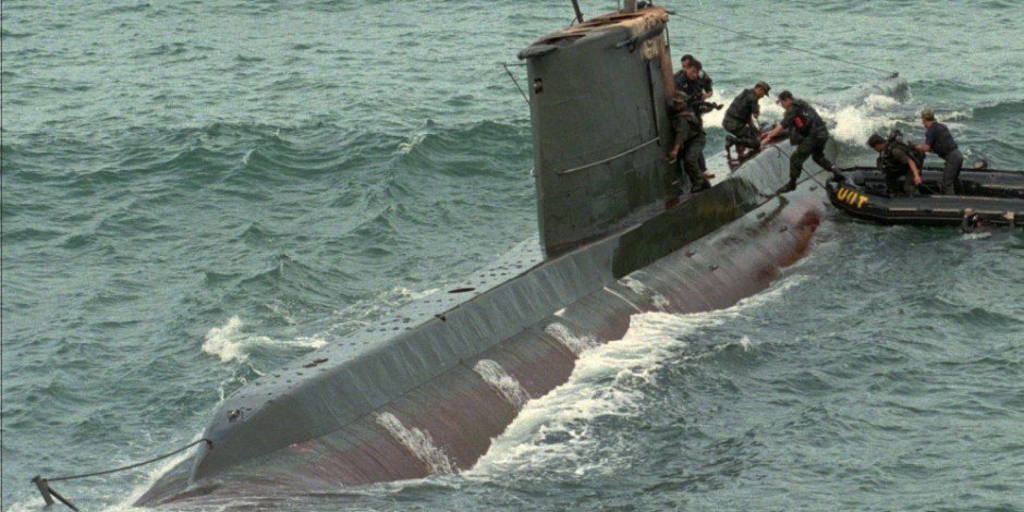 Sang-O submarine that ran aground and was abandoned in 1996 off Gangneung, South Korea. The South Korean boarders in this photo provide a good point of reference in exhibiting the diminutive size of the coastal attack submarine.