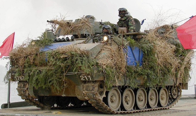 Heavily camouflaged K-200 APC during a winter military exercise.