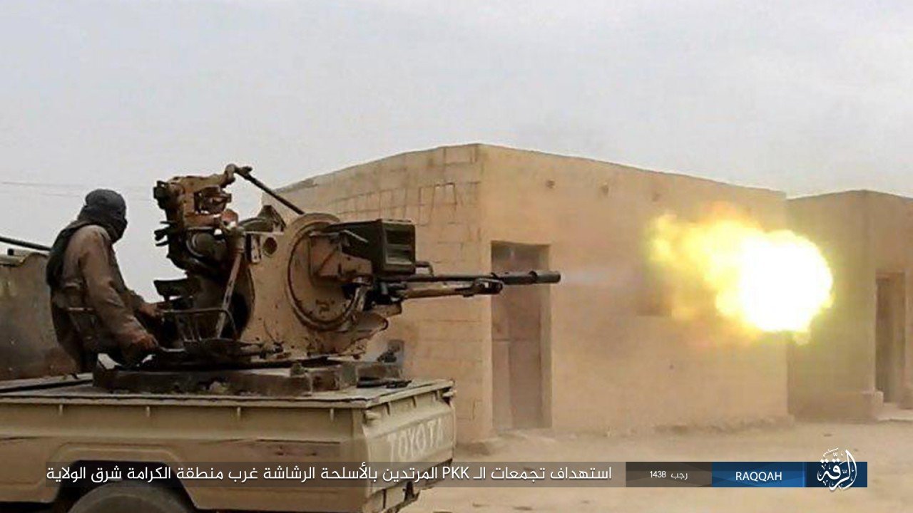 An ISIS technical is in action against the SDF in the province of Raqqah