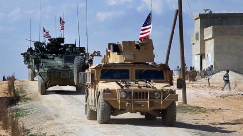 This Tuesday, March 7, 2017 frame grab from video provided by Arab 24 network, shows U.S. forces patrol on the outskirts of the Syrian town, Manbij, a flashpoint between Turkish troops and allied Syrian fighters and U.S.-backed Kurdish fighters, in al-Asaliyah village, Aleppo province, Syria. (Arab 24 network, via AP)